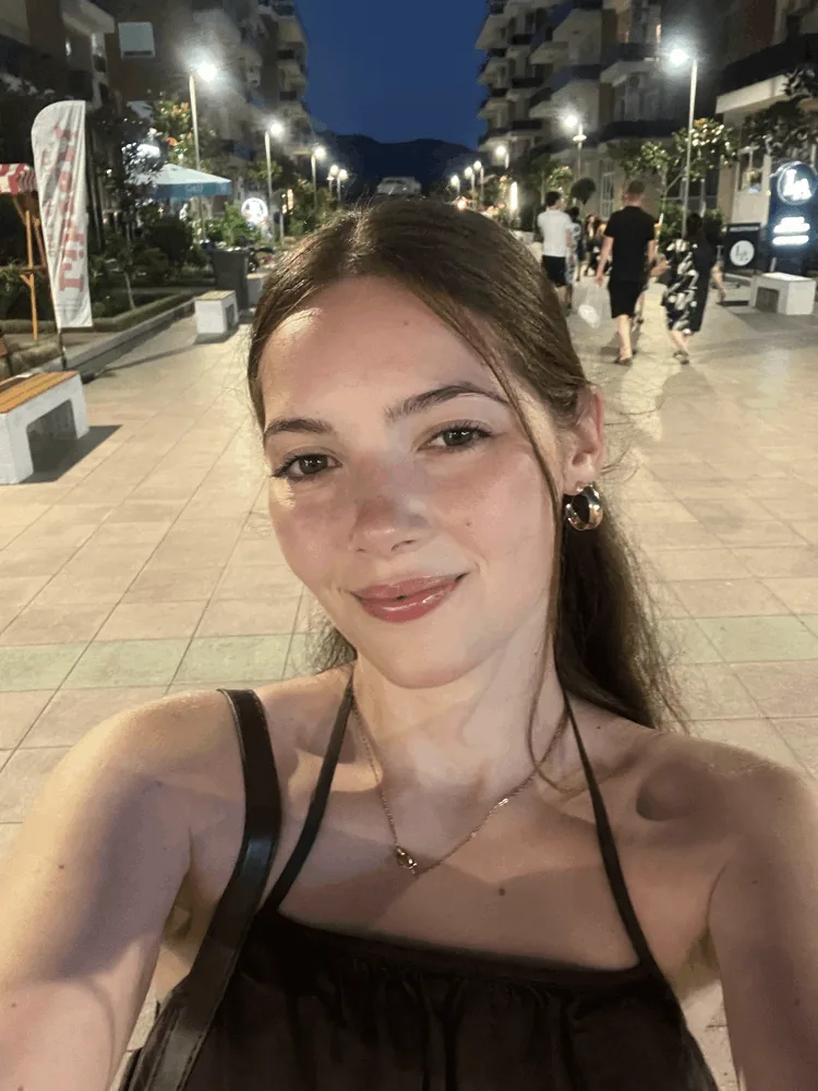 Selfie of Fiona smiling on an evening street