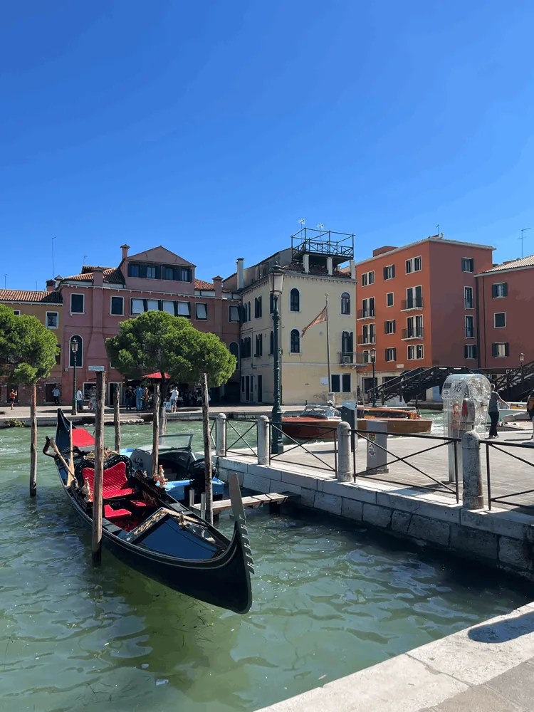 A gondola moored on a canal in Venice
